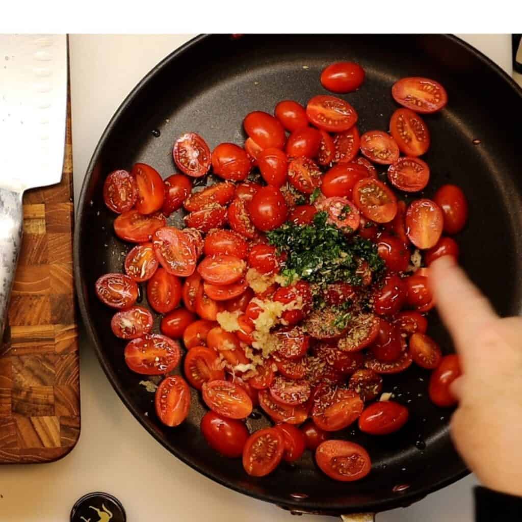 all ingredients ready to cook in a pan for NY Times crispy halloumi with tomatoes and white beans