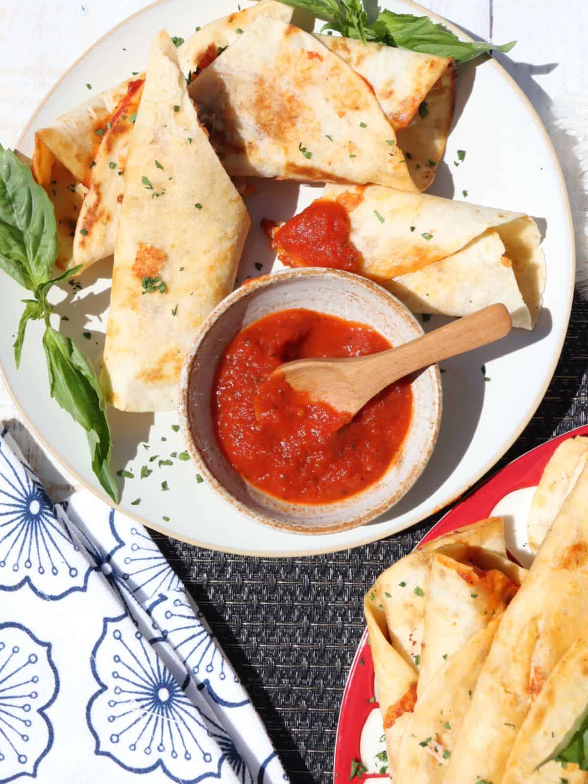 one serving of pepperoni pizza roll-ups on a plate