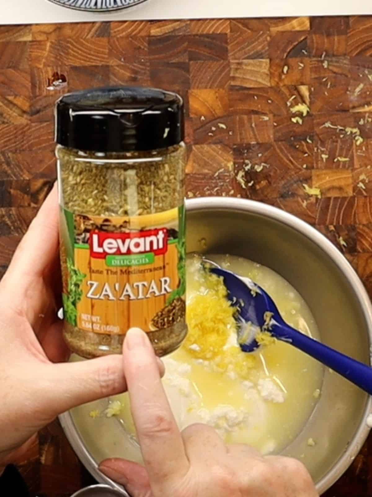 jar of za'atar seasoning for grilled lemon za'atar chicken skewers